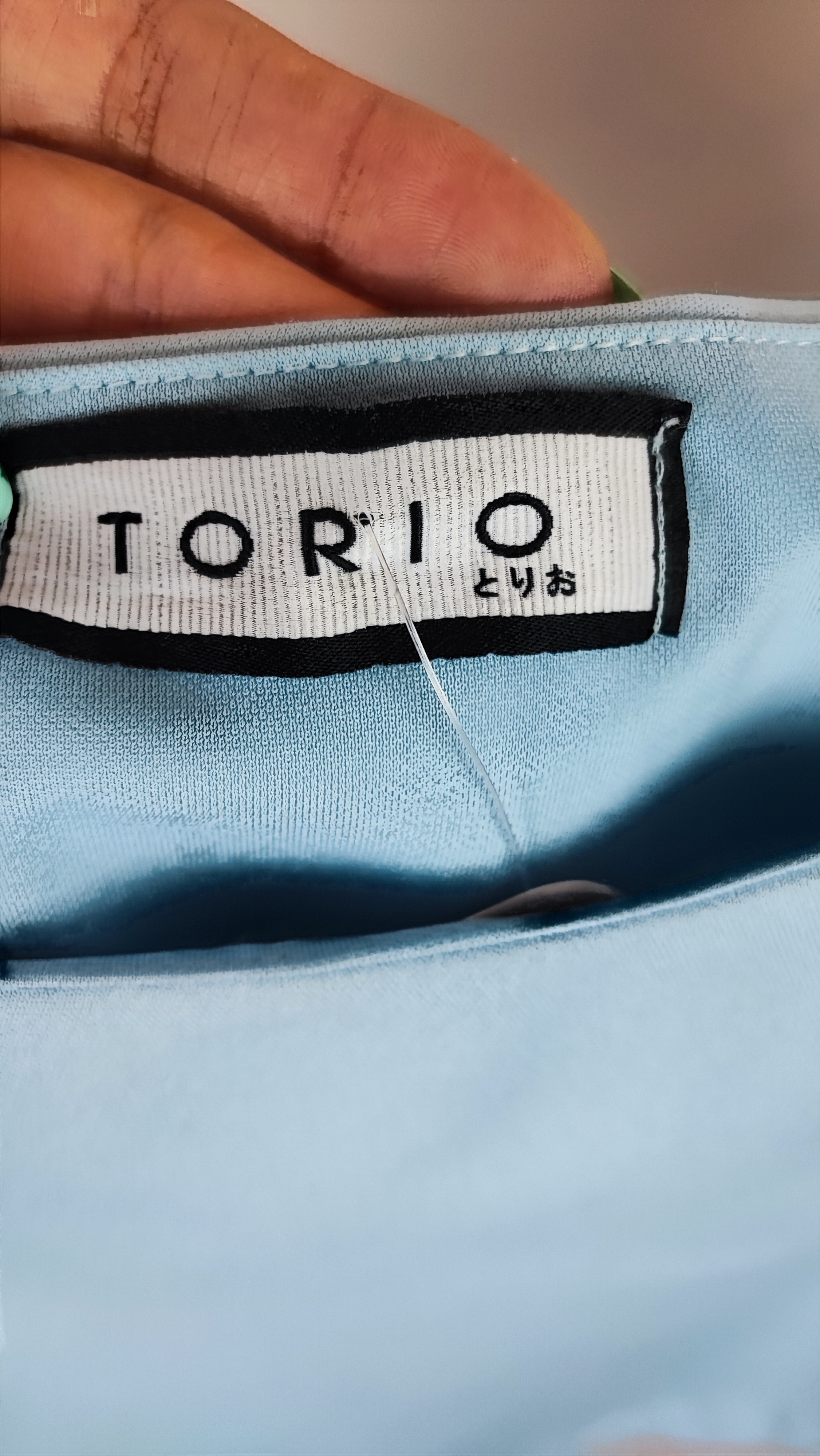 نیمتنه مجلسی زنانه برند توریو (Torio) رنگ آبی ملایم یقه یکطرفه مناسب استایل کژوال و مهمانی