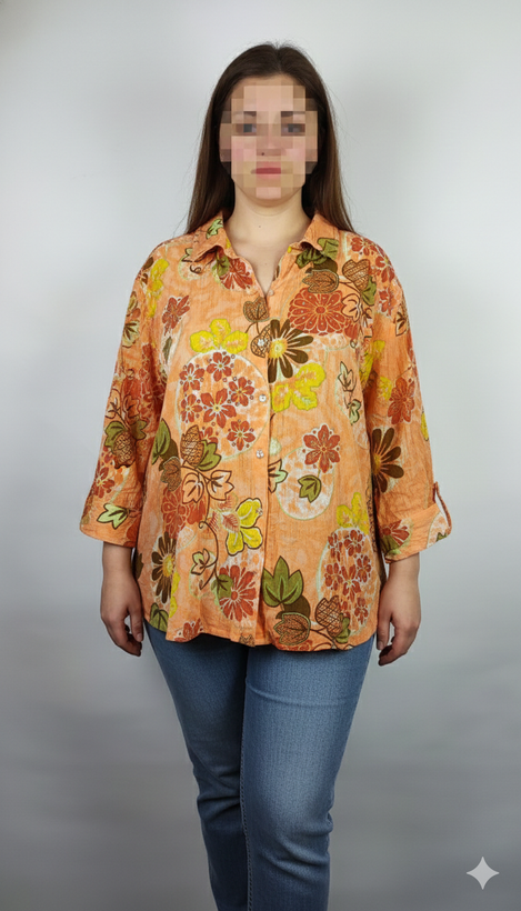 شومیز زنانه طرحدار نارنجی وارداتی با قواره آزاد کد ۱ * تصویر جزئیات: نمای نزدیک از زدگیهای جزئی در بافت پارچه شومیز استوک کد