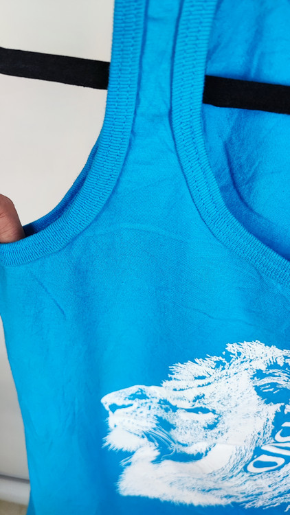 تاپ زنانه آبی کاربنی برند اودکا طرح شیر سفید مناسب استایل اسپرت و روزمره