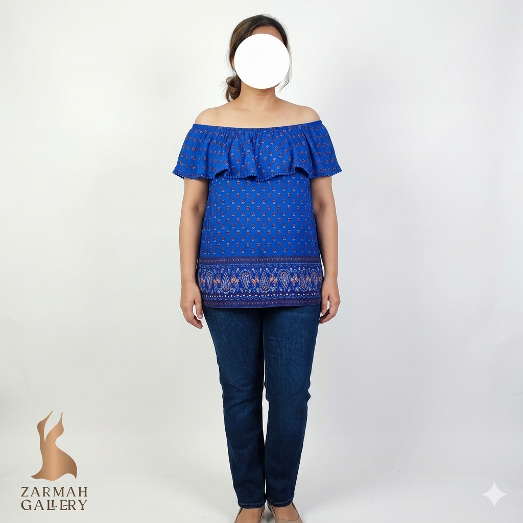 بلوز زنانه سایزبزرگ استوک وارداتی مدل یقه قایقی طرح بتهجقه رنگ آبی جنس ریون خنک برند فیدد گلوری موجود در زرماه گالری