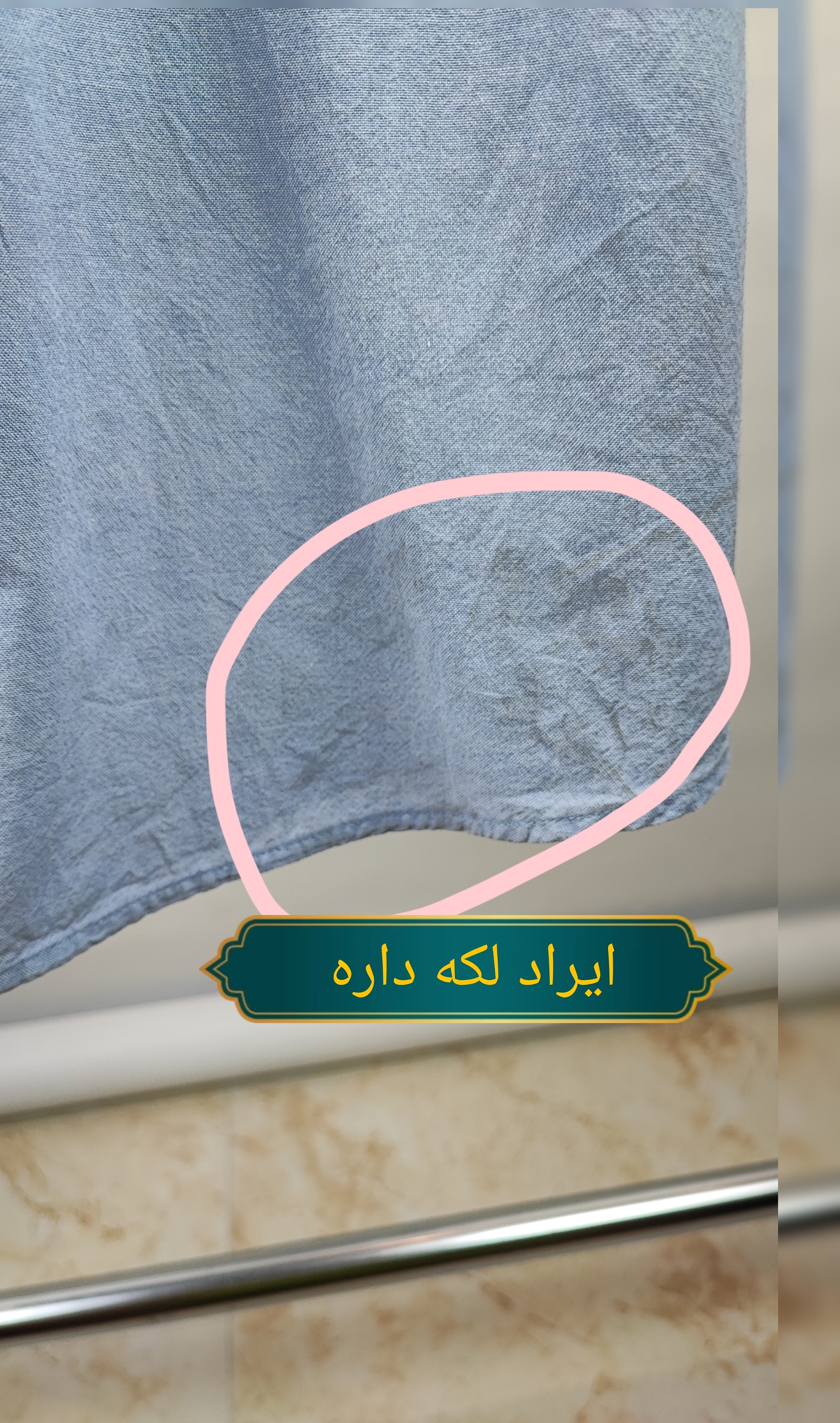 شومیز آستینکوتاه زنانه سایزبزرگ برند K.C. studio رنگ آبی روشن با گلدوزی سفید روی سینه دارای لکه کوچک در لبه پایین لباس