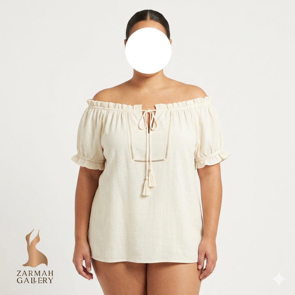 شومیز زنانه سایز بزرگ استوک وارداتی برند فلاور اند فذر رنگ کرم استخوانی یقه قایقی منگوله دار با تصویر ایراد زدگی
