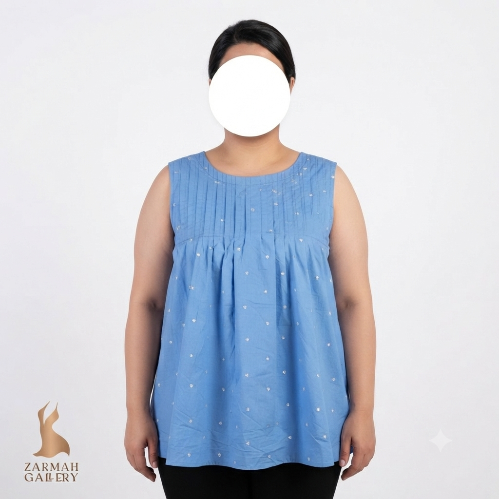تاپ زنانه استوک وارداتی رنگ آبی روشن طرحدار مدل بدون آستین مناسب استایل تابستانه و روزمره